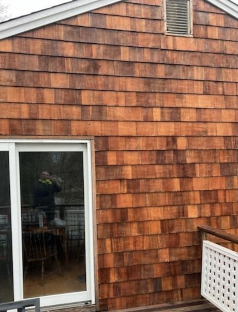 Cedar shake siding after professional cleaning Westerly RI - restored natural cedar tones