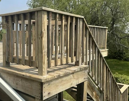 Deck staircase after professional cleaning Charlestown RI - restored natural wood tones on staircase