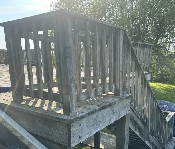 Deck staircase before cleaning Charlestown RI - weathered gray wooden staircase and railings