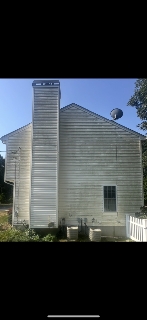 House vinyl siding before cleaning Cranston RI - weathered and discolored with environmental staining