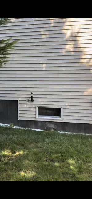 House vinyl siding after professional cleaning Westerly RI - bright white and restored to original condition