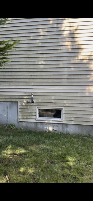 House vinyl siding before cleaning Westerly RI - weathered and stained with algae and environmental buildup