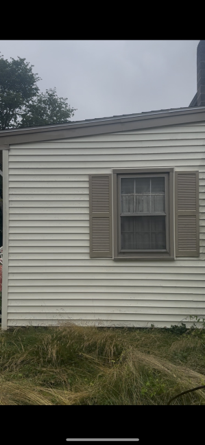 House vinyl siding after professional cleaning Westerly RI - bright white and pristine condition