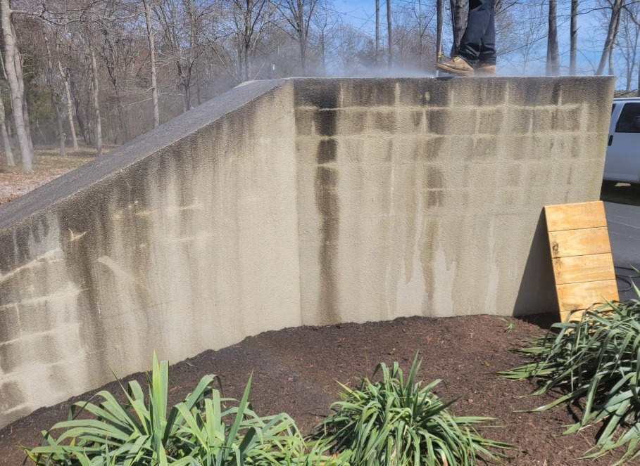 Stucco wall before pressure washing Groton CT - heavily stained with algae and environmental buildup